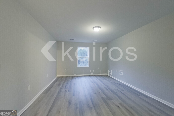 236 Sunrise Circle Midway, GA 31320 - Photo 22 of 31 a view of room with window and hardwood floor