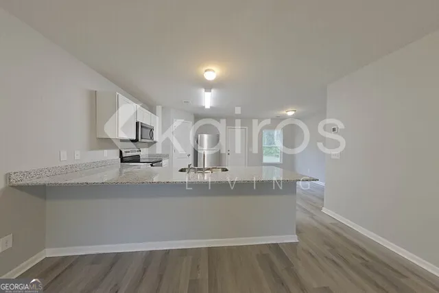 a view of a bathroom with sink and mirror