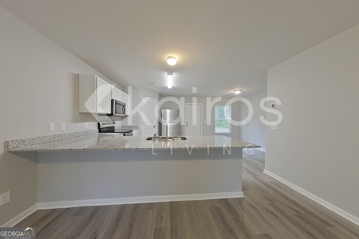 236 Sunrise Circle Midway, GA 31320 - Photo 6 of 31 a view of a bathroom with sink and mirror