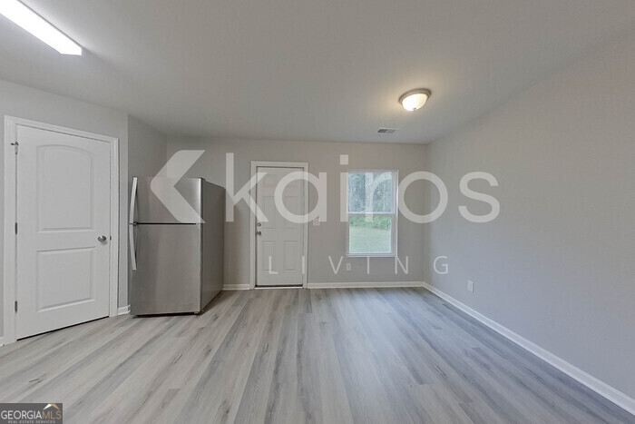 236 Sunrise Circle Midway, GA 31320 - Photo 7 of 31 a view of room with window and wooden floor