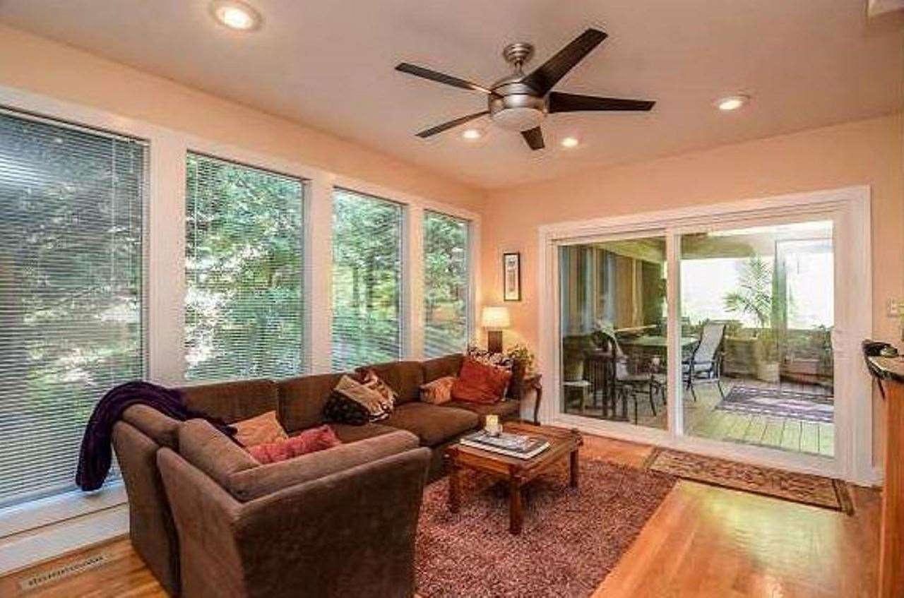 6909 Slade Hill Road Raleigh, NC 27615 - Photo 8 of 25 Family room shot...The family room is open to kitchen and could also be breakfast room and features a window wall to the south and access to huge covered porch and deck. Den/Family/Great Room