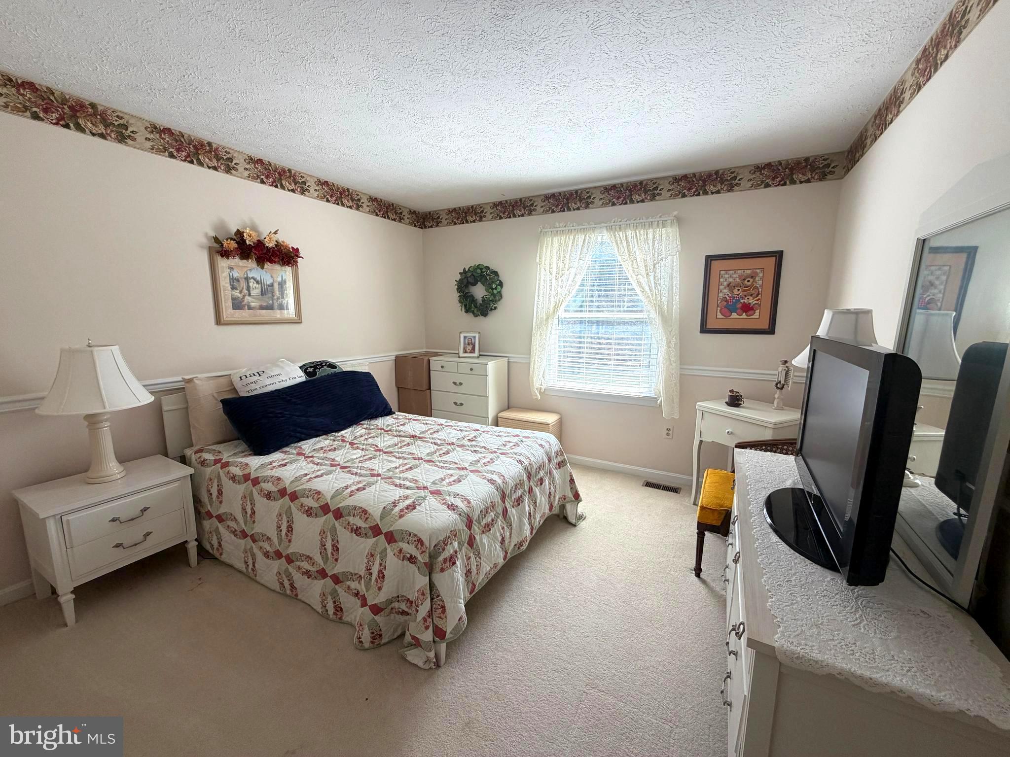 945 Firetower Road Colora, MD 21917 - Photo 17 of 29 a bedroom with a bed couch and a window
