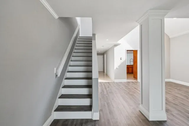 a view of an entryway with wooden floor