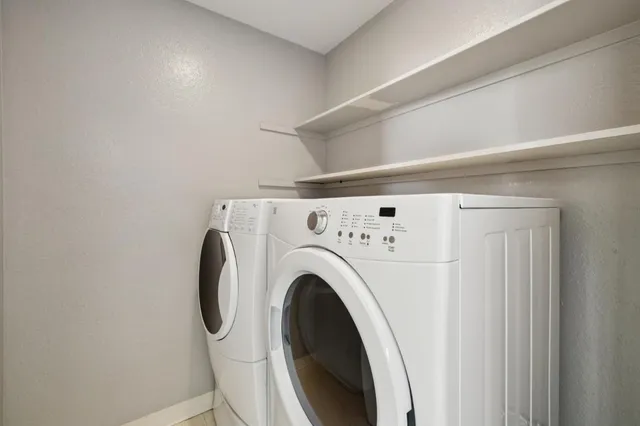 a view of washer and dryer in a utility room