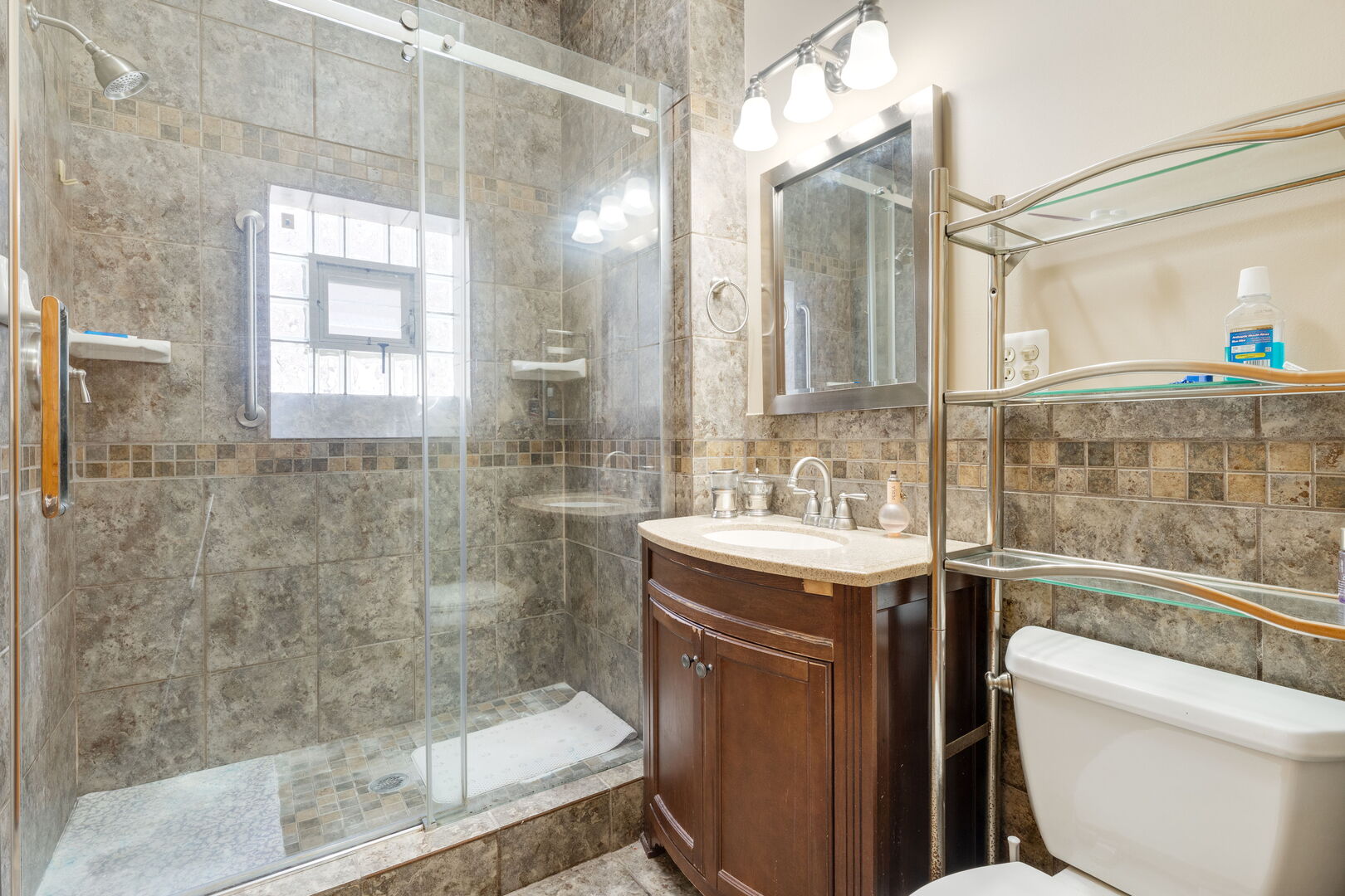 2312 West Taylor Street Chicago, IL 60612 - Photo 8 of 13 a bathroom with a granite countertop sink toilet and shower