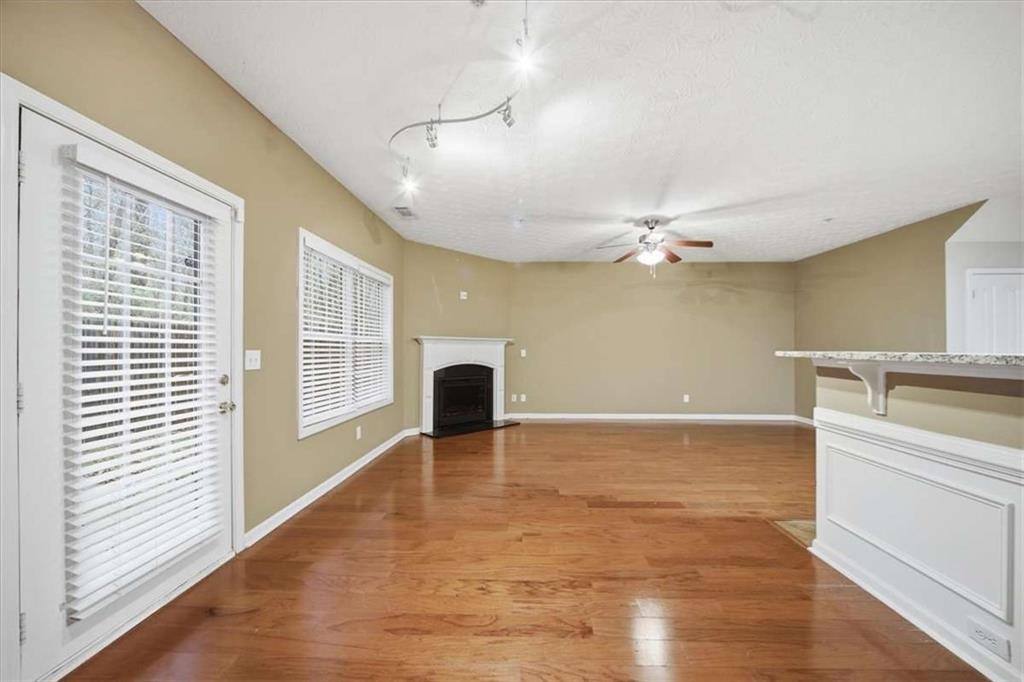 3834 Augustine Place Rex, GA 30273 - Photo 15 of 41 a view of an empty room with a window and wooden floor