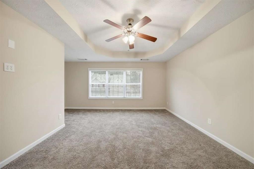 3834 Augustine Place Rex, GA 30273 - Photo 20 of 41 an empty room with fan and windows
