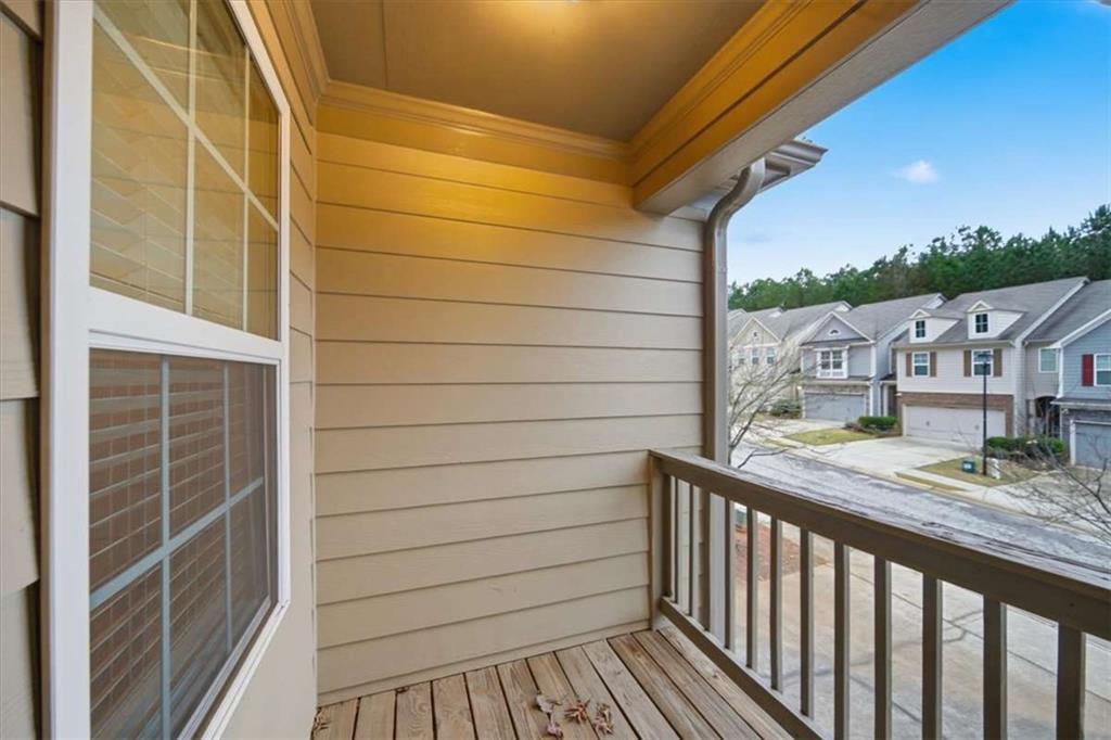 3834 Augustine Place Rex, GA 30273 - Photo 24 of 41 a view of balcony with wooden floor and fence