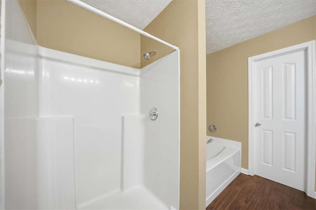 3834 Augustine Place Rex, GA 30273 - Photo 26 of 41 a bathroom with a tub and shower