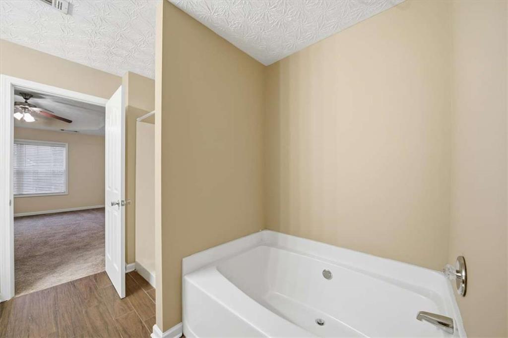 3834 Augustine Place Rex, GA 30273 - Photo 27 of 41 a bathroom with a bathtub