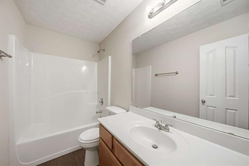 3834 Augustine Place Rex, GA 30273 - Photo 31 of 41 a bathroom with a sink a toilet and shower