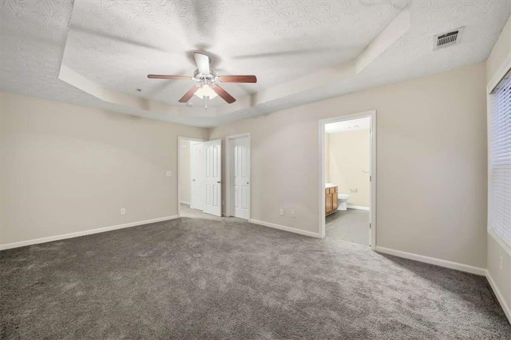 3834 Augustine Place Rex, GA 30273 - Photo 34 of 41 an empty room with chandelier fan and ceiling fan