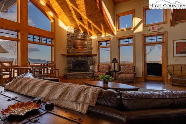 a outdoor living space with furniture and a fireplace