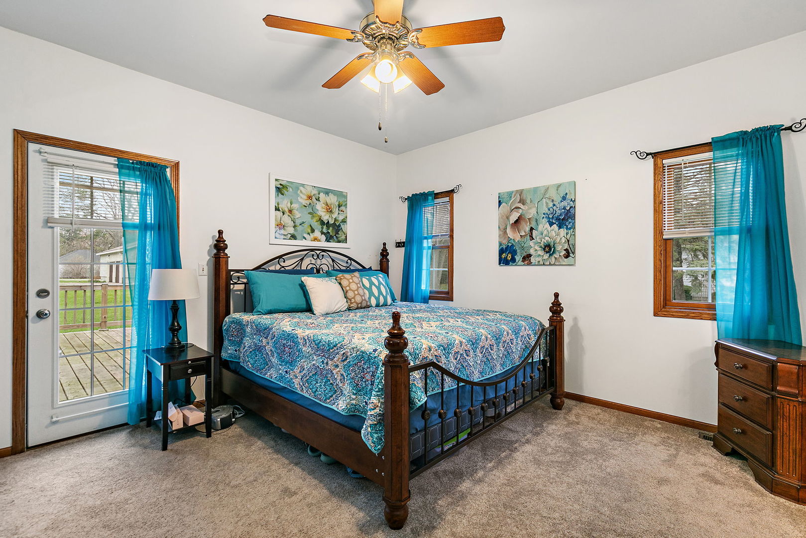 201 West Hardanger Gate Lee, IL 60530 - Photo 12 of 37 a bedroom with a bed and a chandelier