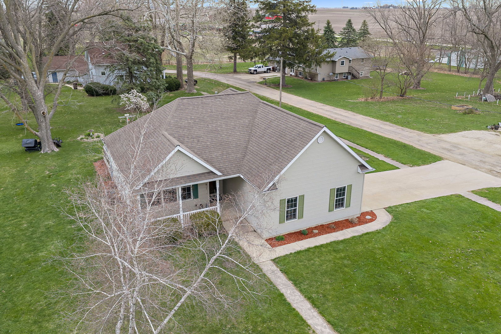 201 West Hardanger Gate Lee, IL 60530 - Photo 29 of 37 a aerial view of a house with a yard table and chairs