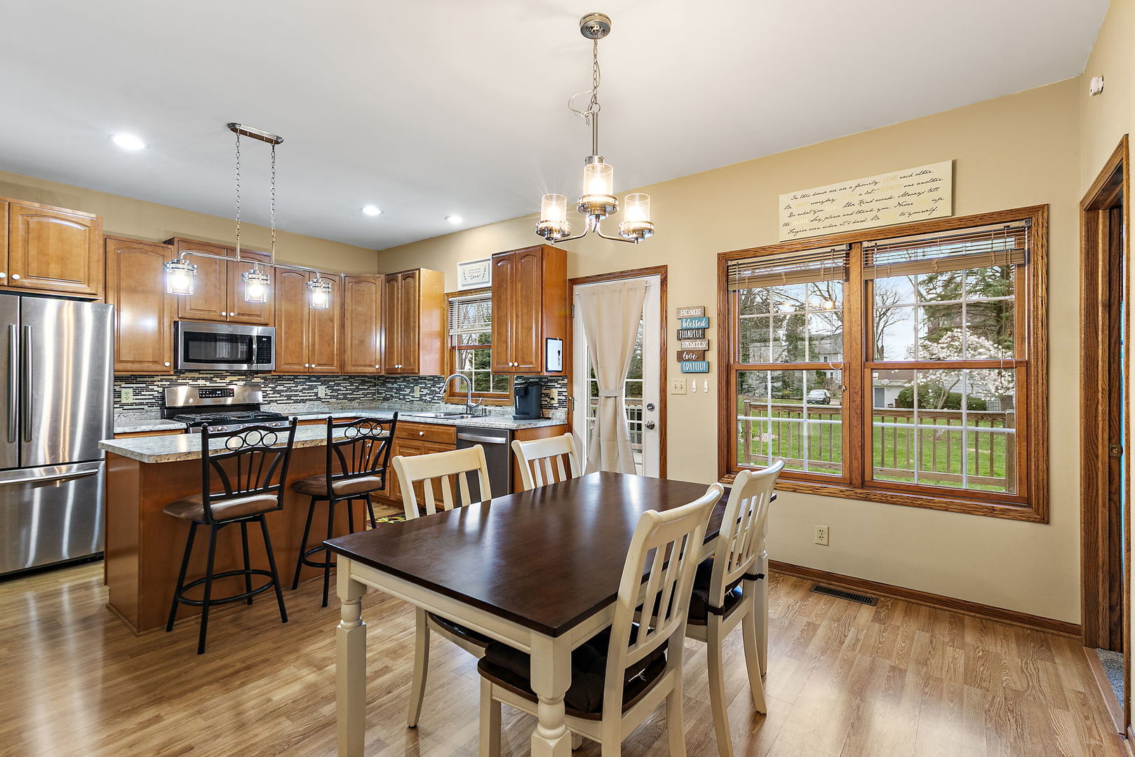 201 West Hardanger Gate Lee, IL 60530 - Photo 7 of 37 a dining room with furniture a chandelier and wooden floor