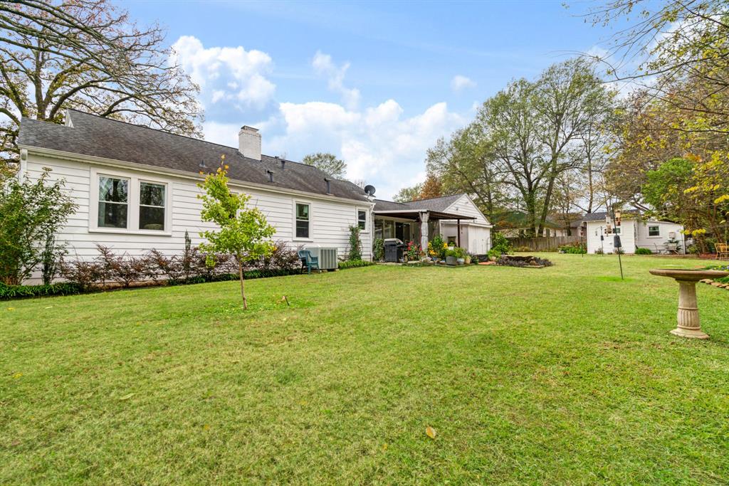 2257 Cleveland Street Paris, TX 75460 - Photo 25 of 39 Rear view of property with a chimney and a patio area