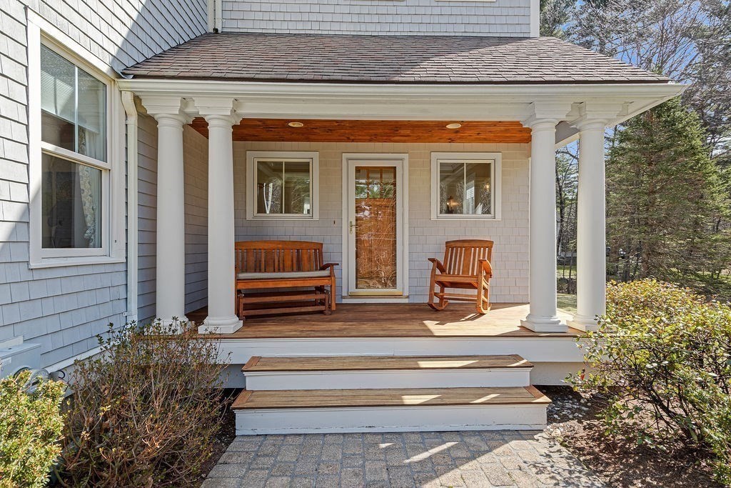 228 Mossman Road Sudbury, MA 01776 - Photo 23 of 42 a front view of a house with entryway