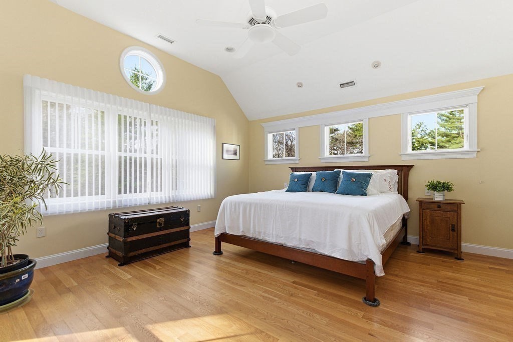 228 Mossman Road Sudbury, MA 01776 - Photo 26 of 42 a bedroom with a bed and a potted plant