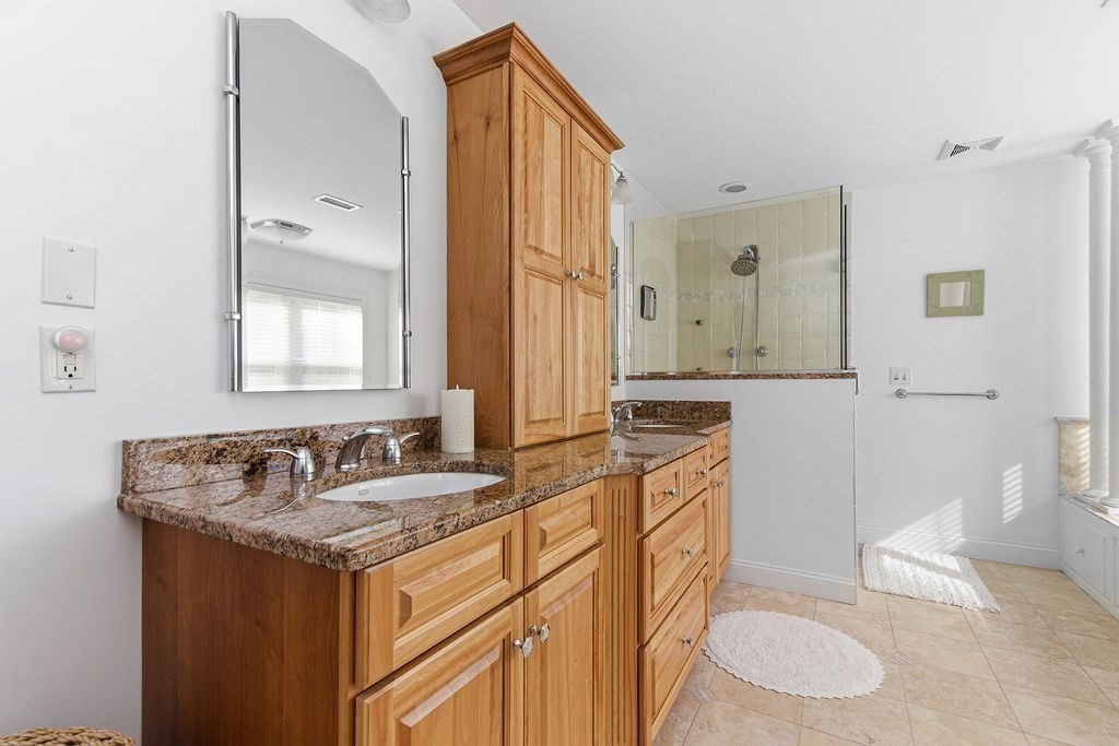 228 Mossman Road Sudbury, MA 01776 - Photo 28 of 42 a bathroom with a granite countertop sink and a mirror