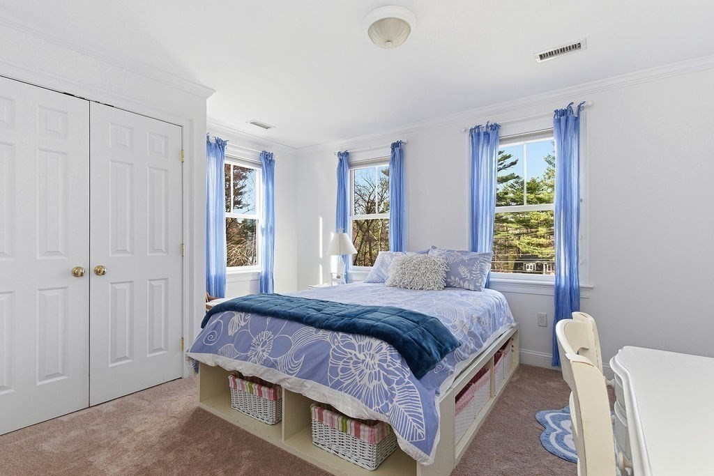 228 Mossman Road Sudbury, MA 01776 - Photo 30 of 42 a bedroom with a bed and a window