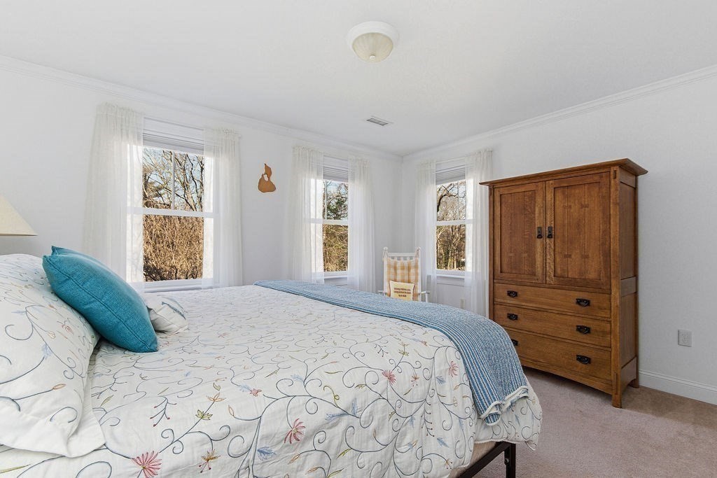 228 Mossman Road Sudbury, MA 01776 - Photo 35 of 42 a bedroom with a bed and a closet