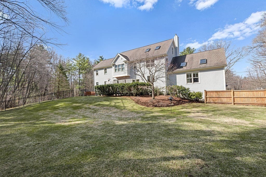228 Mossman Road Sudbury, MA 01776 - Photo 41 of 42 a view of a house with a yard