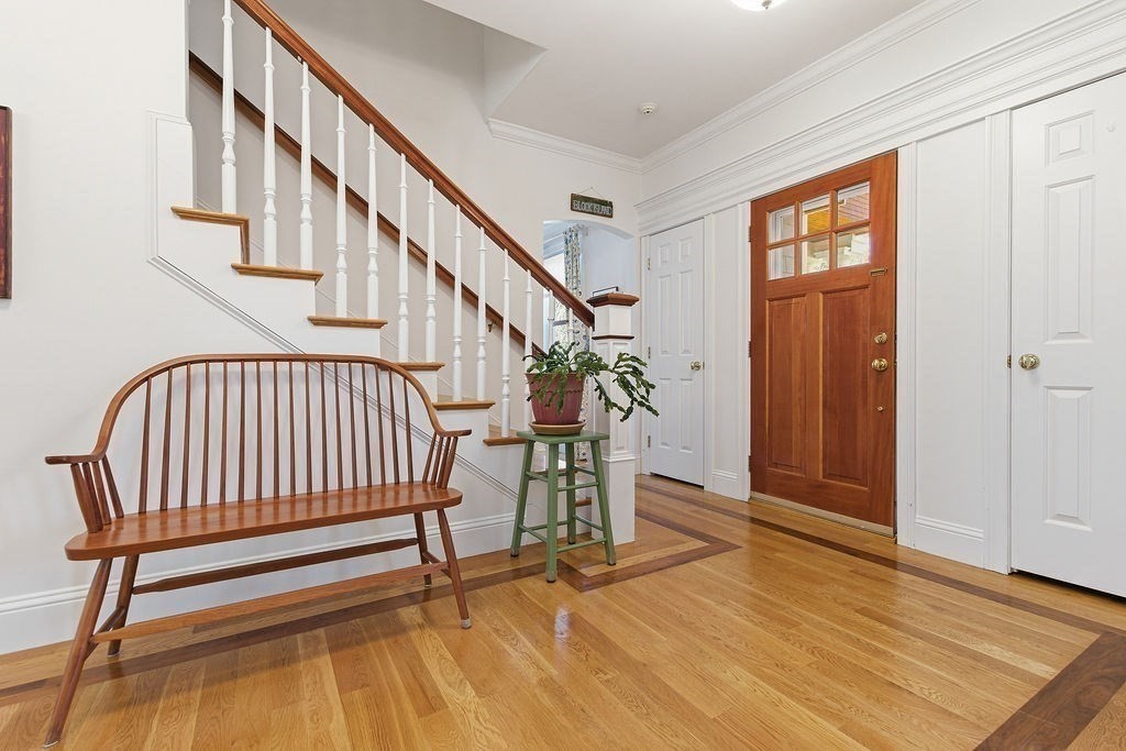 228 Mossman Road Sudbury, MA 01776 - Photo 6 of 42 a view of entryway with wooden floor and stairs