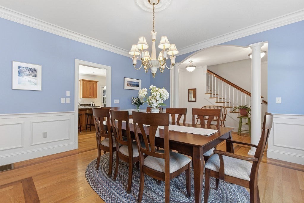 228 Mossman Road Sudbury, MA 01776 - Photo 9 of 42 a view of a dining room with furniture and chandelier