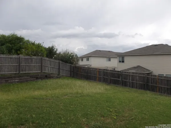 a view of a backyard with a garden