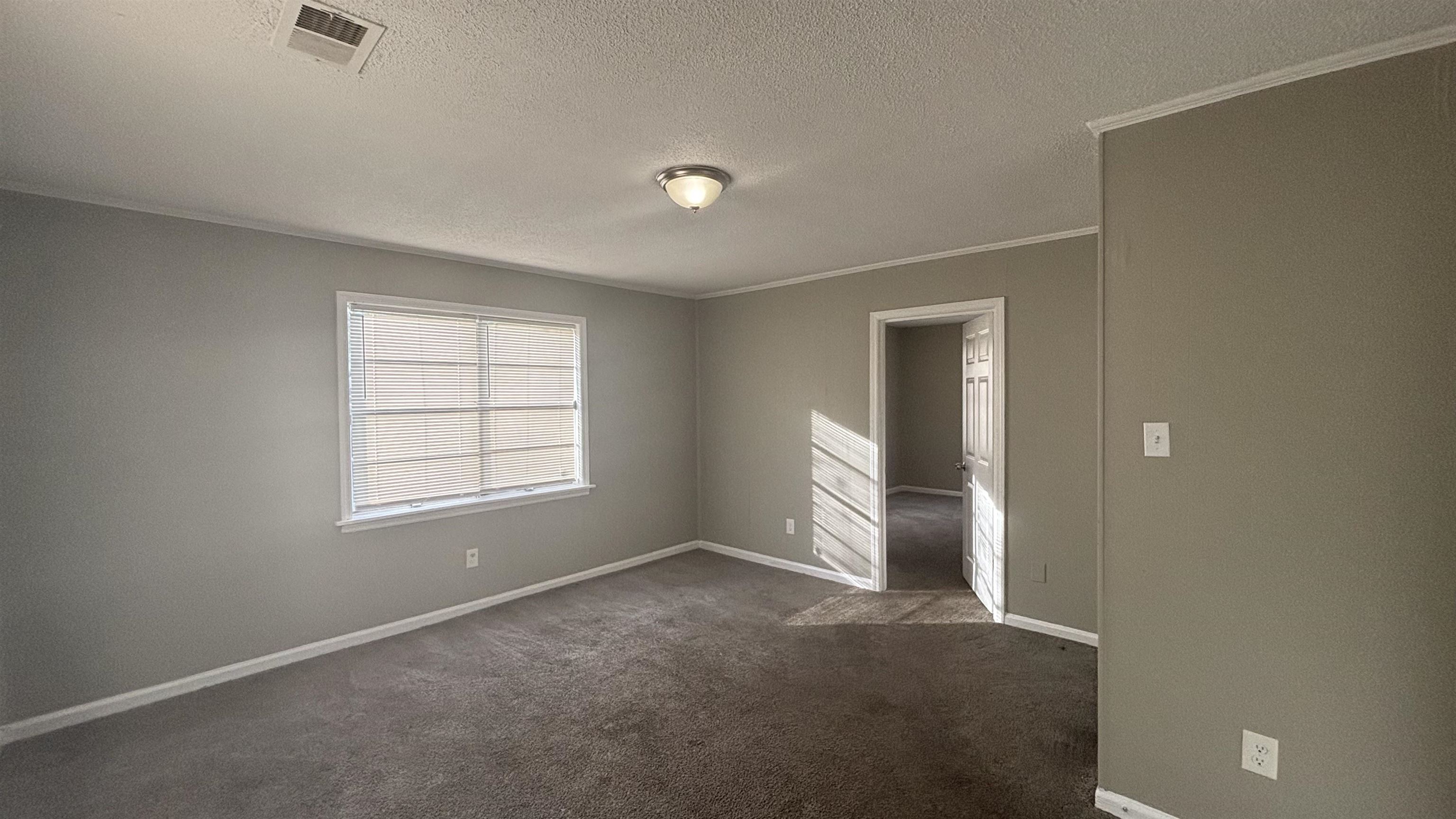 3133 Benjestown Road Memphis, TN 38127 - Photo 9 of 17 a view of an empty room with a window
