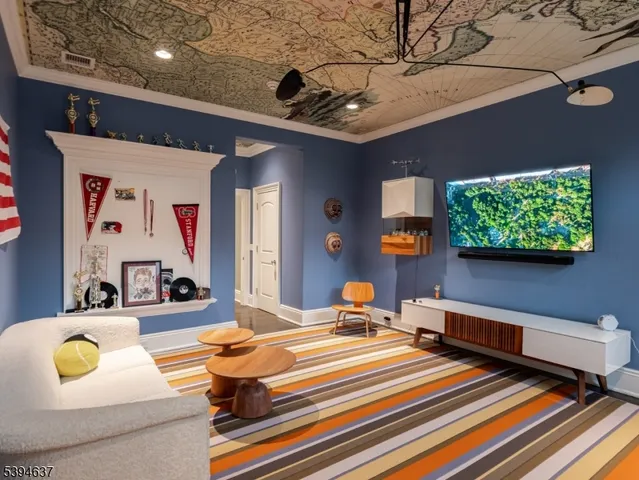 a bedroom with furniture and a flat screen tv