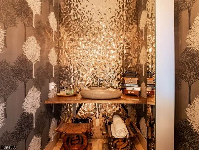 a view of a wooden door and two chairs