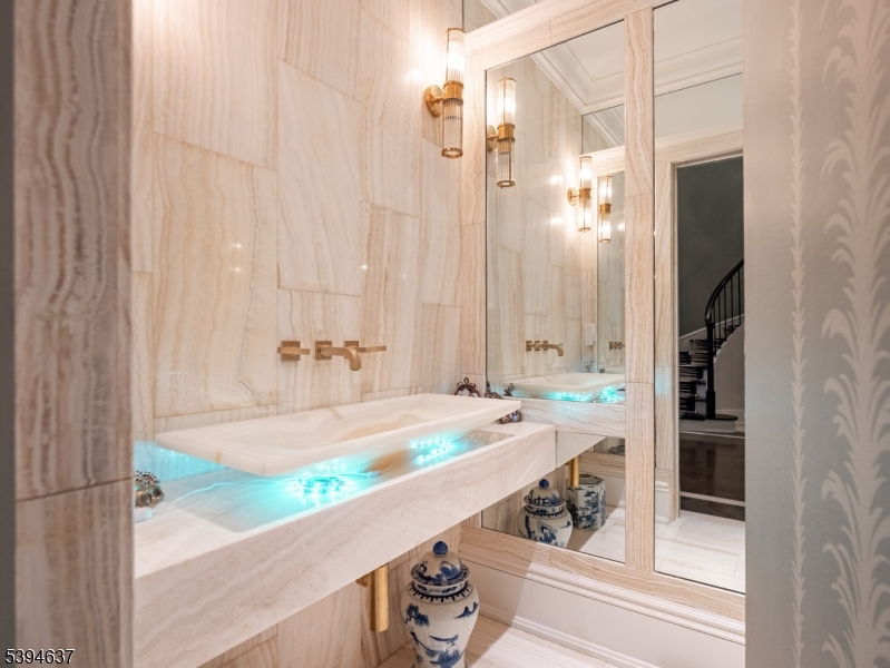 7 Stokes Farm Road Old Tappan, NJ 07675 - Photo 30 of 43 a bathroom with a granite countertop sink and a mirror