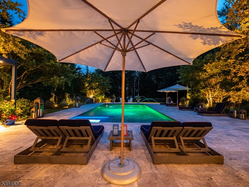 7 Stokes Farm Road Old Tappan, NJ 07675 - Photo 39 of 43 a view of a table and chairs under an umbrella