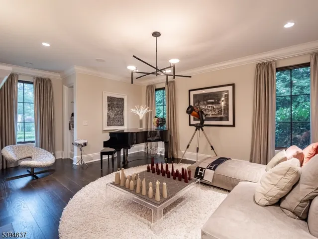 a living room with furniture or window and a wooden floor