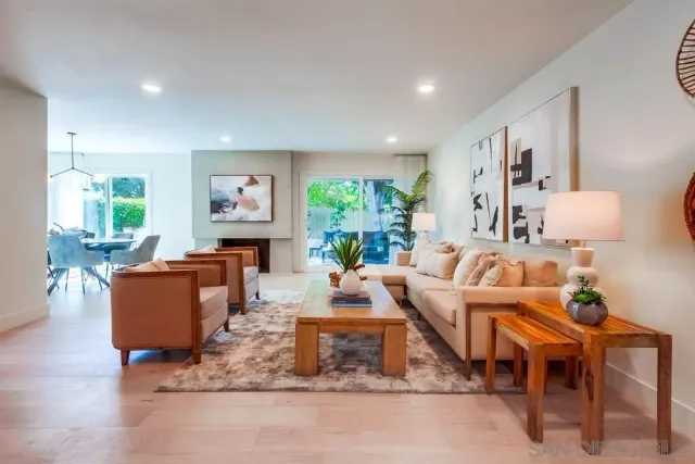 a living room with furniture and a table