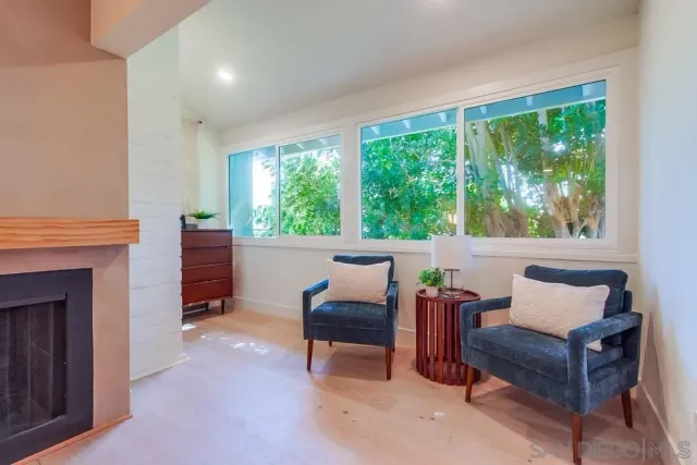a bathroom with a double vanity sink toilet mirror and bathtub