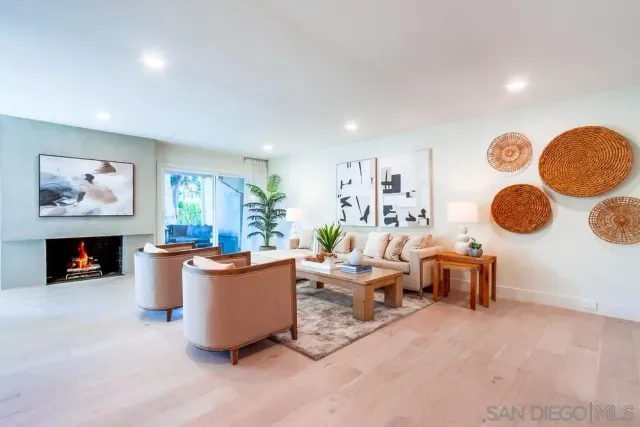 a living room with furniture a window and a table