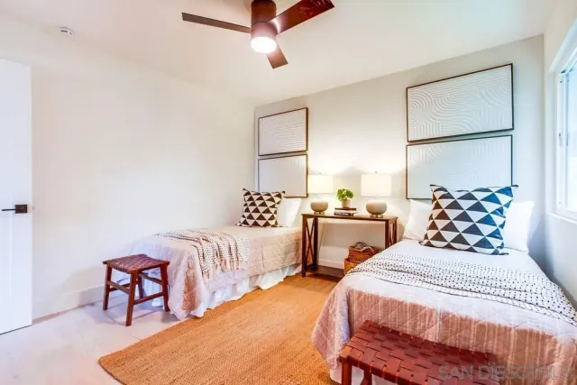 a living room with furniture and potted plant