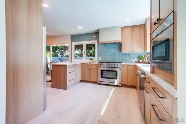 a living room with furniture a couch and a potted plant