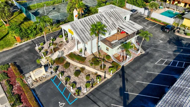 an aerial view of a house with a lake view
