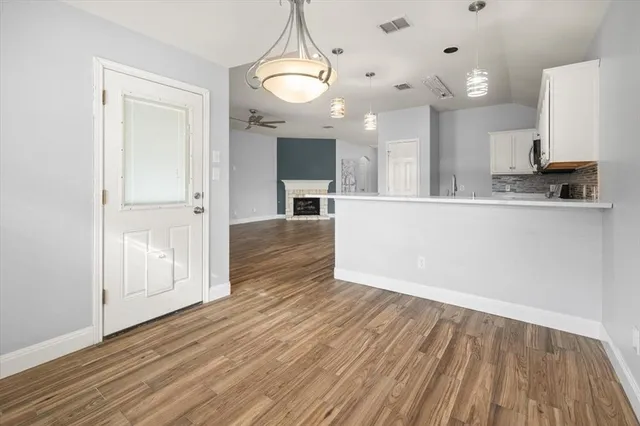 a view of a kitchen from the hallway