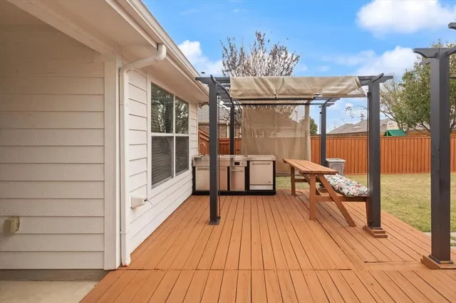 a view of a balcony with couch and wooden floor