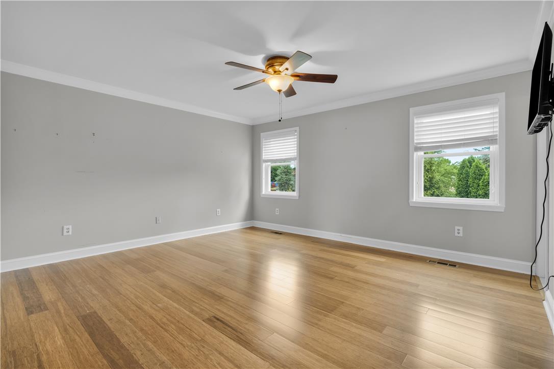 3396 Darien Road Bethlehem, PA 18020 - Photo 31 of 44 Hardwood floors and generous windows elevate this spacious bedroom.