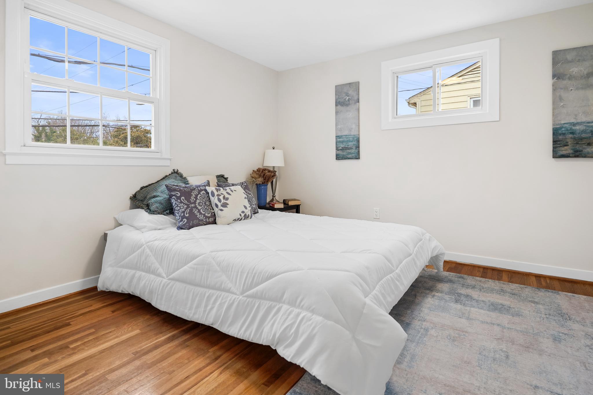 404 Kerby Hill Road Fort Washington, MD 20744 - Photo 11 of 24 a bedroom with a bed and wooden floor