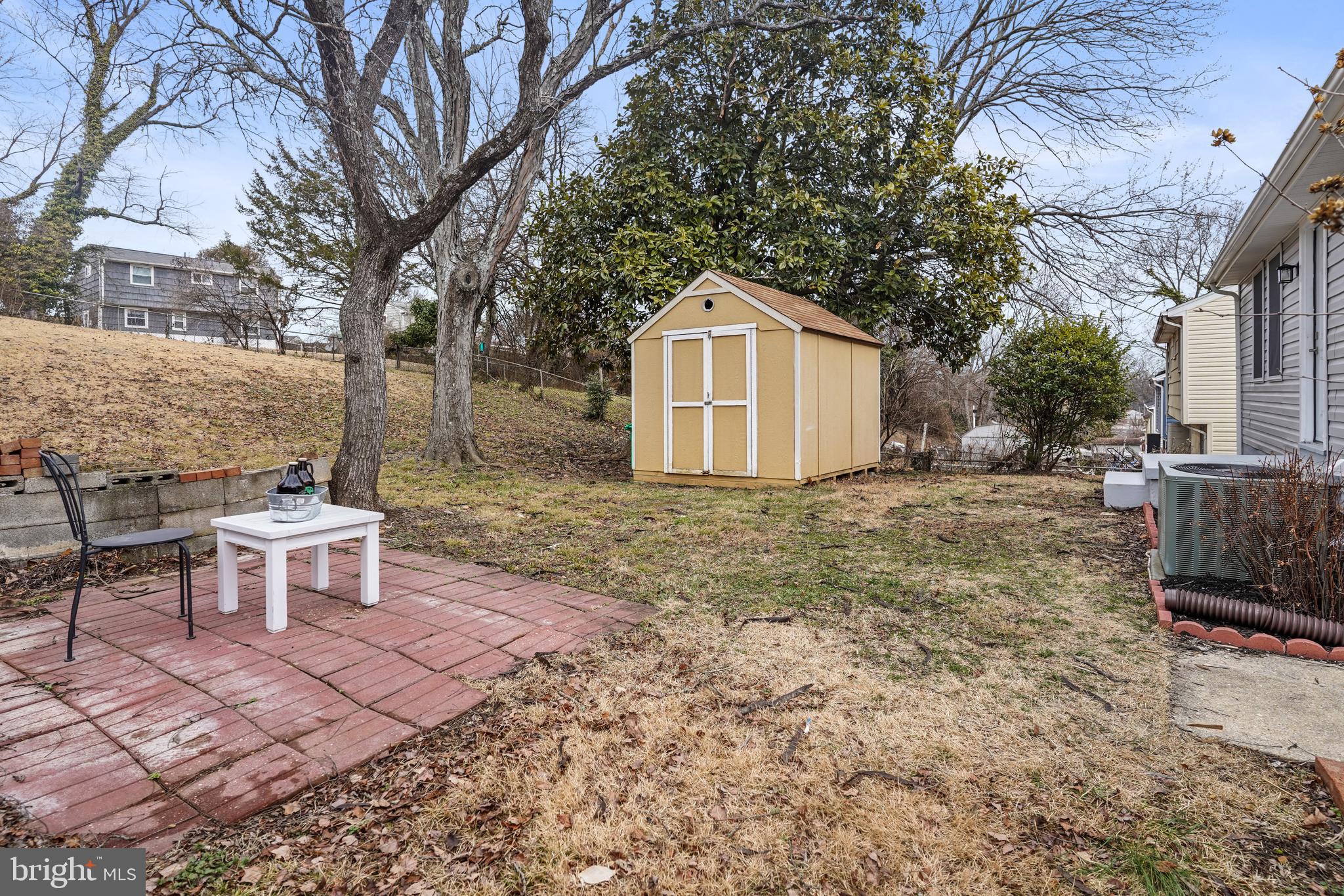 404 Kerby Hill Road Fort Washington, MD 20744 - Photo 20 of 24 a view of a backyard with a garden and outdoor seating