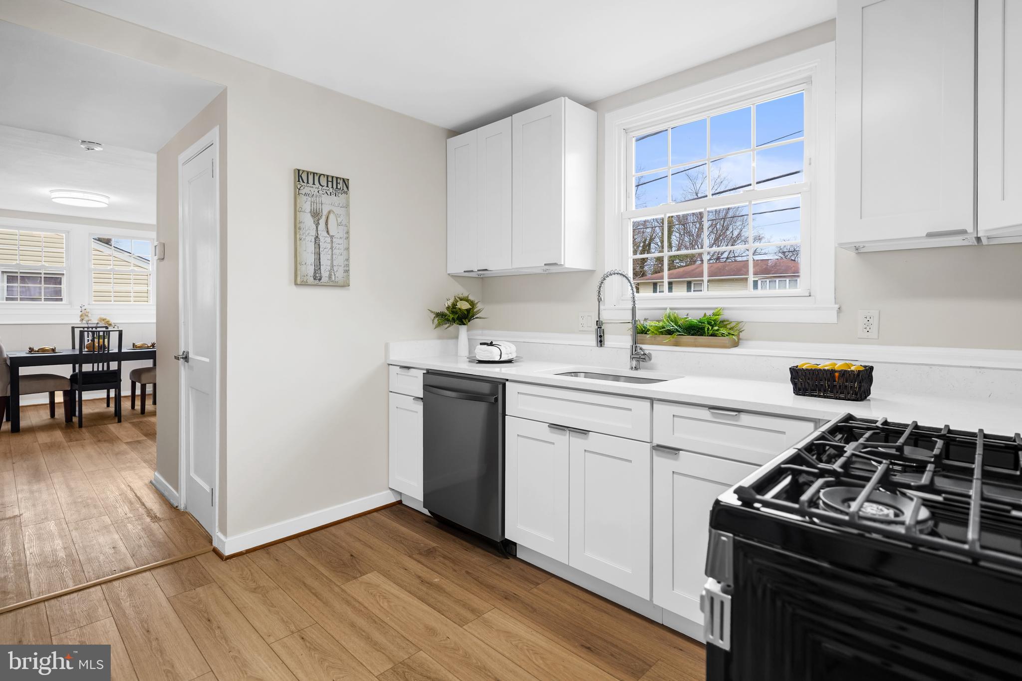 404 Kerby Hill Road Fort Washington, MD 20744 - Photo 5 of 24 a kitchen with a stove a sink and a refrigerator