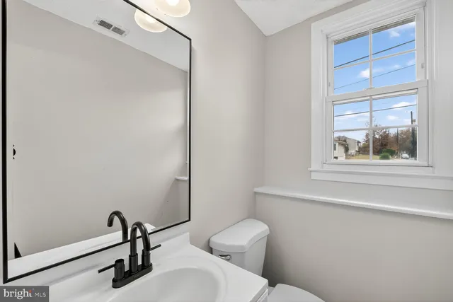 a bathroom with a toilet and a sink