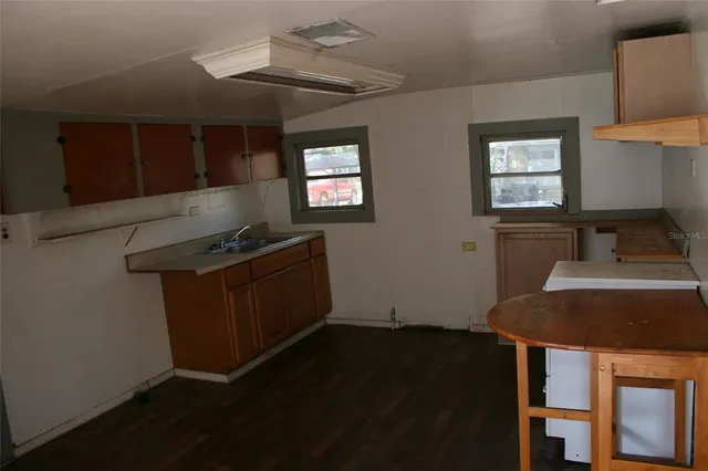 an empty room with wooden floor